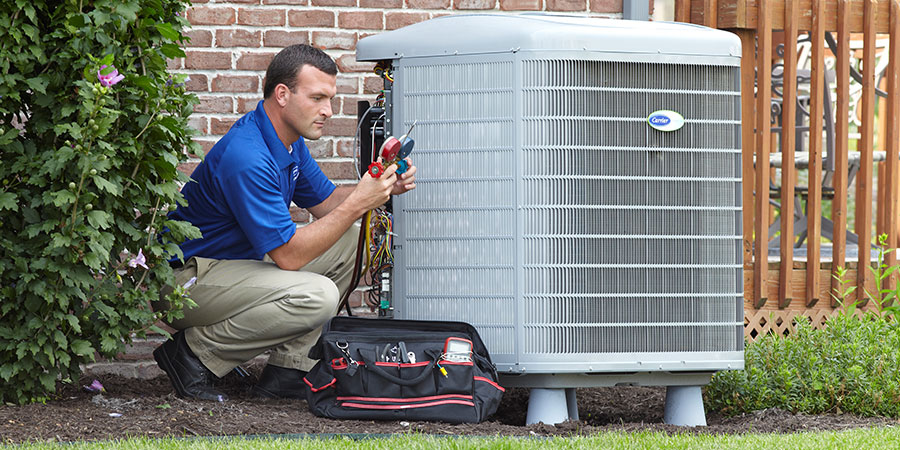 Service technician inspecting gauges